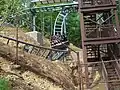 Part of Mystery Mine's back section, preceding the 95 degree drop. The car is exiting the U-turn that was removed prior to the 2021 season.