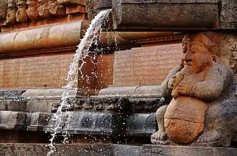 Bhagiratha beneath a gargoyle at the Brihadisvara Temple, Thanjavur, India