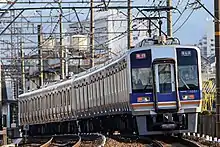 The lone four-car set attached to an 8300 series set on an express service to Osaka-Namba