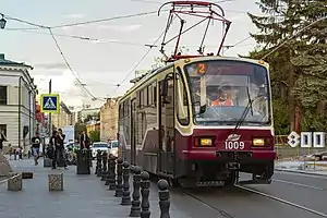 Red-and-white tram on a city street