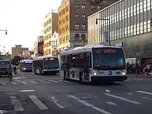 MTA 3rd and 4th Gen LFS buses, followed by a LFS Artic, in Flushing, Queens, NYC.