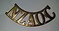 Brass NZAOC sholder tab 1917–1945