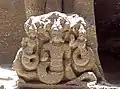A motif of a snake goddess. Carving on volcanic rock at the Kailash Temple, Ellora, India