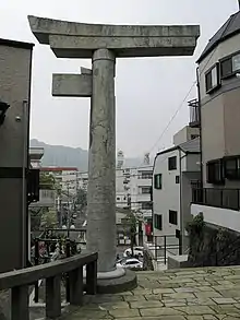 One-legged torii, Sannō Shrine, Nagasaki, Japan. The other half was toppled in the explosion of the nuclear bomb.