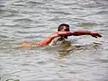 A man swimming in the Wouri River