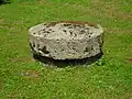 Old millstone from the village on public display