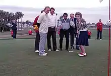Nancy Reagan reacting to a putt with Jack Nicklaus, Lee Trevino, and Raymond Floyd in 1987