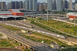 A CRH High-Speed train enters Harbin West railway station.