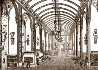 Long indoor gallery with arched ceiling and lavish carvings