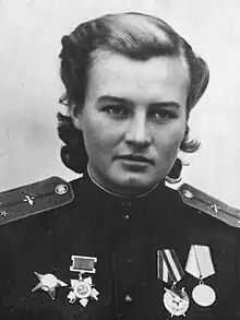 Photo of woman in decorated military uniform