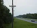 Highway 98 going through the Naval Live Oaks.