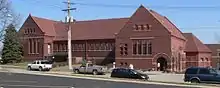 Brick building with pitched tile roof