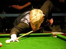 Neil Robertson playing a shot on the pink ball.