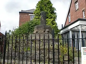 The weathered remains of a small stone monument