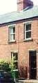 House featuring original sash windows and granite lintels