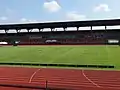 Grass field at the center of the stadium (with the Capas National Shrine seen on the background)