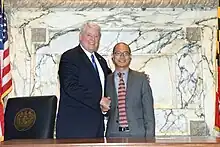 Busch stands next to Moon at the Speaker's desk in the Maryland House of Delegates