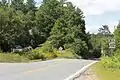 At intersection of Cemetery Rd in Swiftwater, about two miles east of its western terminus at US 302