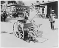 New York City Street sweeper and handcart