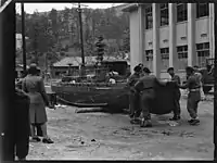 New Zealand Divisional Cavalry soldiers inspecting a model of a Japanese battleship on Etajima