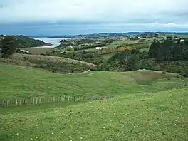 The Pacific Coast highway near Whitford has views of the surrounding countryside, farms, and Hauraki Gulf