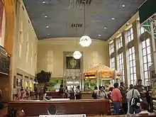 Interior of main waiting room, featuring an information booth