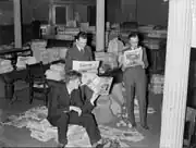 Men reading confiscated literature in Montreal City Hall, 1938.