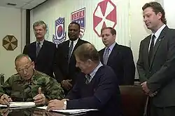 Image 22National Federation of Federal Employees officials sign a collective bargaining agreement with the U.S. 8th Army in October 2002.