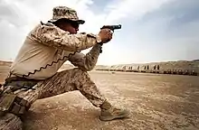 A Marine with the 215th Afghan National Army Mobile Strike Force Security Force Assistance Advisor Team engages his target during a small arms fire drill on Camp Leatherneck, Helmand province, Afghanistan, June 28, 2013.