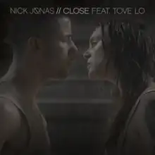 The single's two artists, Nick Jonas and Tove Lo, stare at each other, both sweaty and appear to be emotional over an issue