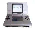 Nintendo's Nintendo DS (pictured) and Game Boy Advance were the best-selling portable systems of the decade. Games released for the Nintendo DS in the 2000s included Brain Age, Personal Trainer: Cooking, New Super Mario Bros., Super Mario 64 DS, and Grand Theft Auto: Chinatown Wars.