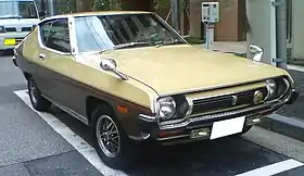 Front-three-quarter view of a two-door car with wing mirrors