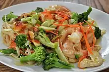 Noodle stir-fry with chicken, shrimp, and broccoli