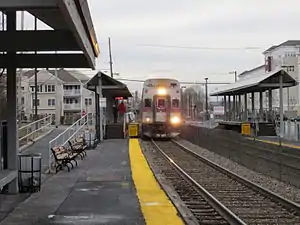 A train arriving at a suburban railway station