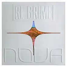 The cover image features a white background with a four-pointed star in the centre, with an image of a star included within. The album's artist and title are listed on the top and bottom respectively.