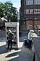 Browsing a public bookcase in Essen, Germany