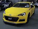 Subaru BRZ tS, a high-performance variant of the standard Subaru BRZ coupe. This photo shows the front of the car, which is yellow with a small "STI" emblem on the front grille.