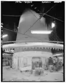 massive round chimney indoors with entrances on sides