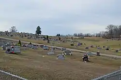 Oak Hill Cemetery, east of the village