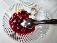 Saxon Quarkkäulchen served with hot sour cherries