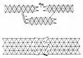 A complex obstacle belt of low wire entanglement backed by a double apron fence. Both obstacles have movable openings that can be blocked with knife rests.