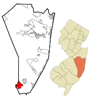Location of Mystic Island in Ocean County highlighted in red (left). Inset map: Location of Ocean County in New Jersey highlighted in orange (right).