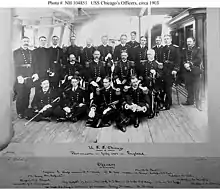 Wood as a lieutenant, seated on the deck in the front row on the right in this photograph of the officers of the protected cruiser USS Chicago, ca. 1903.