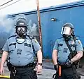 Officers of the Saint Paul Police Department in FM12 gas masks on 2020 George Floyd protests in the city