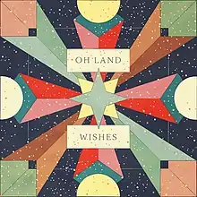 A symmetrical pattern of various-shaped polygons appear, in different shades of primary and secondary colors; the background is a navy-colored square with yellow and orange polka-dots scattered atop it. It also contains the words "Oh Land" and "Wishes" in all-caps.