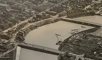C. 1923, as the riverfront cleanup began