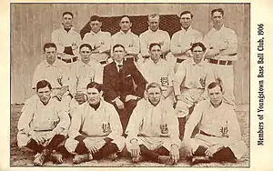 Group of 15 men standing in three rows.