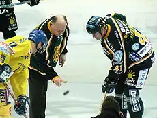 Lasse Oksanen (dropping the puck) was inducted in 1999 for Finland.