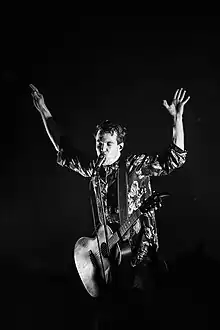 Black and white picture of a man performing live