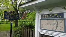 a picture of the marker next to a kiosk sheltering a map labeled Historic Hurley